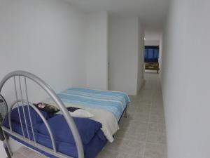 a hospital room with a bed and a hallway at Depto Zona UV Lagos Isleta 103 in Xalapa