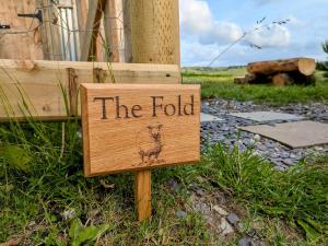 a sign that says the fold with a drawing on it at The Fold - Unique Cabin Nestled in Nature in Llangerniew