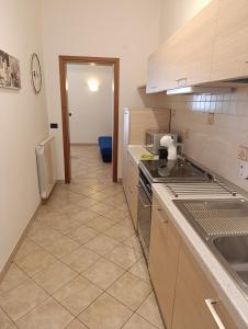 a kitchen with a sink and a counter top at La Casa dei Pescatori in Caorle
