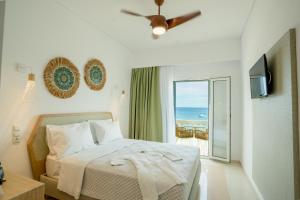A bed or beds in a room at Ionion Beach Resort
