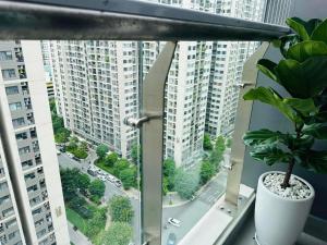 a potted plant sitting on a window sill in a building at Ruby Homestay Vip Oceanpark in Gia Lâm Pho