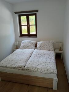 Postel nebo postele na pokoji v ubytování Rekreační dům