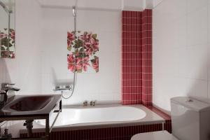 a bathroom with a bath tub and a sink at Eirini luxury Apartments in Keramoti +25 photos