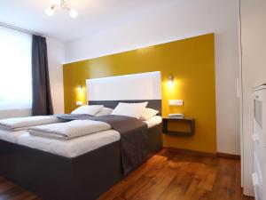 Postel nebo postele na pokoji v ubytování TS Apartments