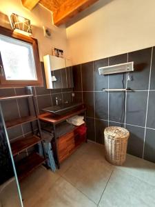 a bathroom with a sink and a counter in a room at La villa des 3 frontières in Porté-Puymorens +23 photos