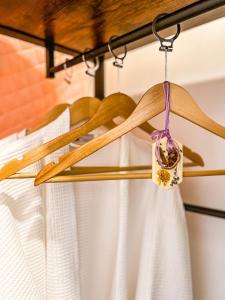 a wooden shelf with a flower on it at River Glamping Boutique Jarabacoa in Jarabacoa