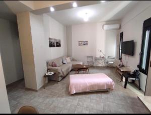 a living room with a bed and a couch at Kavala Summer in Kavála