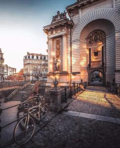 a bike parked in front of a building at L'épicurieux in Lille +4 photos