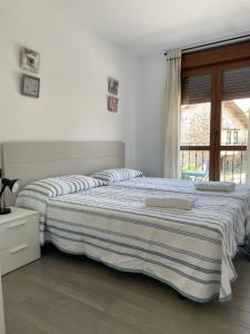 Posteľ alebo postele v izbe v ubytovaní Apartamento Rústico