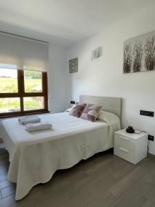 Posteľ alebo postele v izbe v ubytovaní Apartamento Rústico
