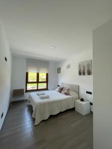 Posteľ alebo postele v izbe v ubytovaní Apartamento Rústico
