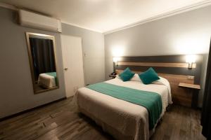 Ένα ή περισσότερα κρεβάτια σε δωμάτιο στο Hotel Real