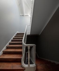 a staircase with a metal railing and a stair case at Flattered to be in Tomar in Tomar