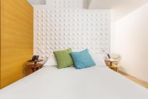 Postel nebo postele na pokoji v ubytování Xilhotel by Perle di Puglia