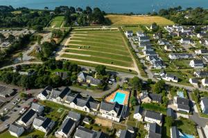 an aerial view of a village with houses and a park at Résidence Odalys Les Iles du Morbihan in Baden