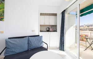 a living room with a bed and a kitchen at Beautiful Apartment In Benalmadena in Benalmádena