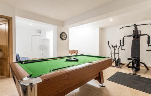 a room with a pool table in a room at Awesome Home In Avileses in Avileses +20 photos