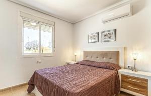 a bedroom with a bed and a window at Awesome Home In Avileses in Avileses