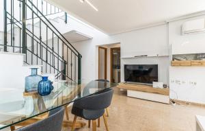 a dining room with a glass table and chairs at Awesome Home In Avileses in Avileses