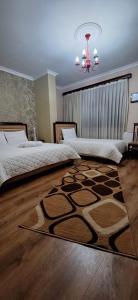 Postel nebo postele na pokoji v ubytování Hotel Theo
