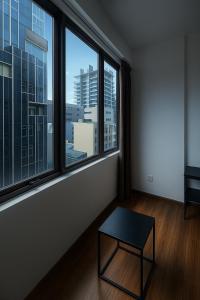 a room with a table in front of a window at Arrival View in Male City