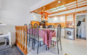 a kitchen with a table and chairs in a room at Awesome Home In Tossa De Mar With Wifi in Tossa de Mar