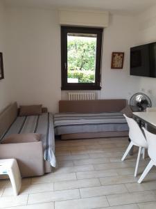 Televízia a/alebo spoločenská miestnosť v ubytovaní Casa Lisa