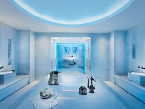 a blue room with a sink and a window at Swissôtel Resort Bodrum Beach in Turgutreis