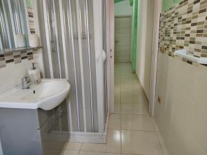 a bathroom with a sink and a walk in shower at COUNTRY HOUSE in Mafalda +41 photos