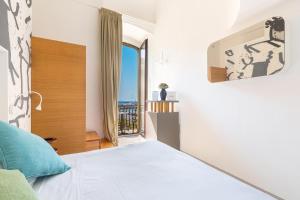 Postel nebo postele na pokoji v ubytování Xilhotel by Perle di Puglia