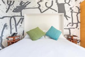 Postel nebo postele na pokoji v ubytování Xilhotel by Perle di Puglia