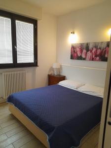 A bed or beds in a room at Casa Lisa