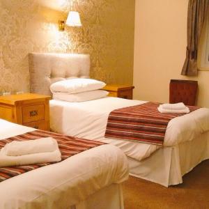 Ένα ή περισσότερα κρεβάτια σε δωμάτιο στο Strawberry Bank Hotel, NEC