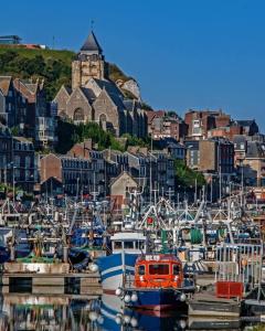 a bunch of boats are docked in a harbor at LA CLOSERIE D'ISABAULT in Eu