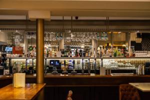 a bar with a lot of liquor bottles at The Psalter in Sheffield