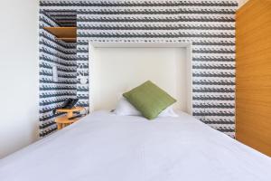 Postel nebo postele na pokoji v ubytování Xilhotel by Perle di Puglia