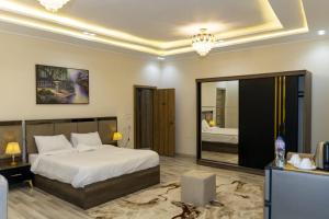 Voodi või voodid majutusasutuse Maktub Pyramids Hotel toas