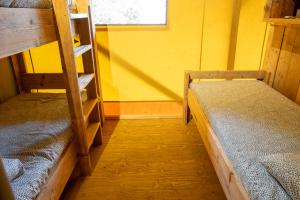 Postel nebo postele na pokoji v ubytování Hoeve Linnerveld XL