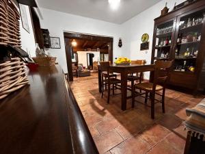 a kitchen with a table and chairs in a room at villa Cycas in Maratea