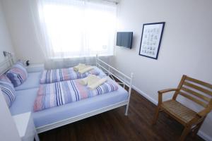 Postel nebo postele na pokoji v ubytování Klabautermann 5