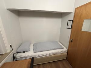 Uma cama ou camas num quarto em Guesthouse Andrea