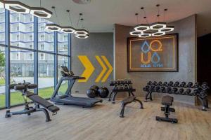 a gym with exercise equipment in a building at Arena jakovi condotel in Cam Ranh International Airport
