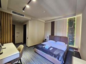 Voodi või voodid majutusasutuse Tskaltubo Epic Hotel & Spa toas