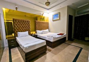 Ένα ή περισσότερα κρεβάτια σε δωμάτιο στο Dove inn Hotel near Shaukat Khanum Hospital