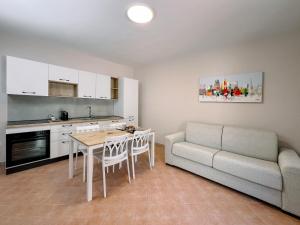 a living room with a couch and a table at Al Giardino del Pepe in Lanciano