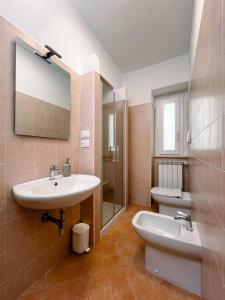 a bathroom with a sink and a toilet at Al Giardino del Pepe in Lanciano +8 photos