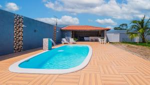 Πισίνα στο ή κοντά στο Casa com WiFi, churrasqueira e otima localizacao