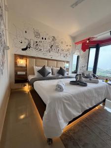 a bedroom with two beds with white sheets at Casa Felice Stays in Guwahati