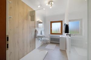 a bathroom with a toilet and a sink at Urlaub in der Sonnenstadt 72351 in Geislingen +12 photos