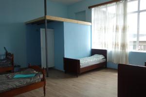 Postel nebo postele na pokoji v ubytování Nomads Nest
